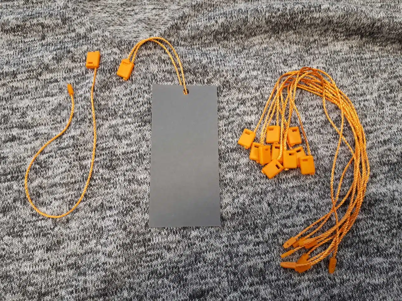 Oranje klikboxen met oranje touwtje van 160 mm lang - Per 1000 stuks